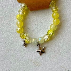 Yellow bracelet with charm